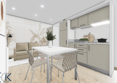 Au premier plan on vois une table blanche avec des chaise beige. derrière cette table on voit une kitchenette de couleurs beige avec des rangement en dessous eu dessus et sur la gauche. Dans le fond on aperçoit un canapé beige aussi . Des appliques au plafond sont visibles. le sol est couleur bois clair